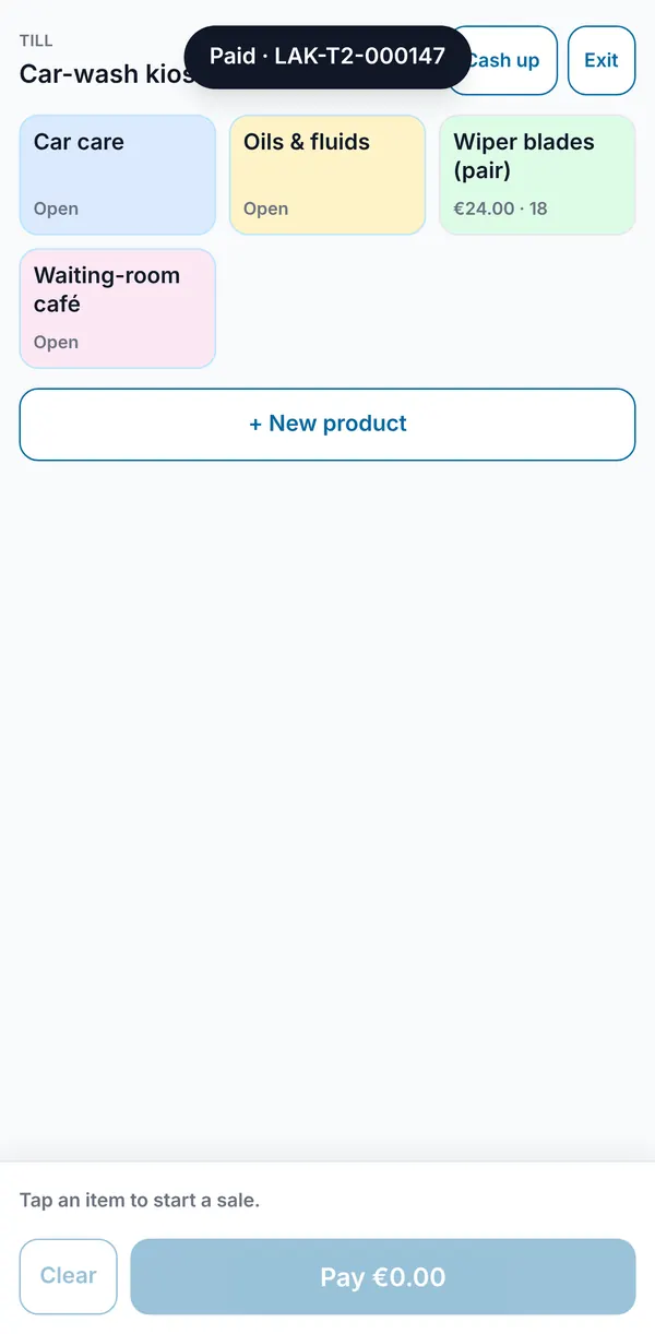A paid sale confirmed with its receipt number, and the till empty and ready for the next customer.